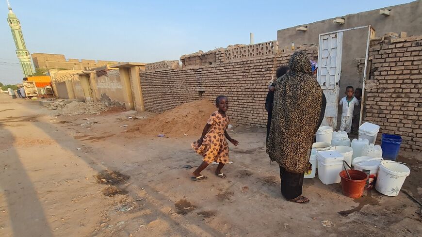 Containers of water, which is in short supply in Khartoum during Sudan's war