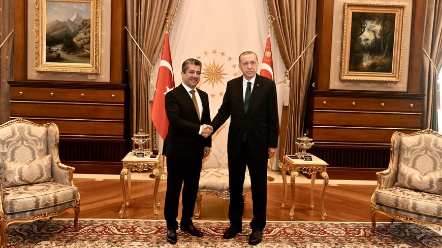 Iraqi Kurdistan Region Prime Minister Masrour Barzani (L) meets with Turkey's President Recep Tayyip Erdogan (R) in Ankara, June 20, 2023.