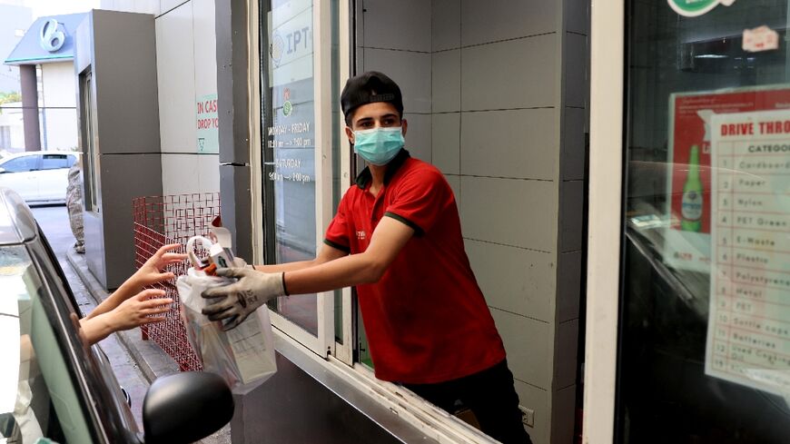 Drivers exchange empty bottles and cardboard for cash, easing both Lebanon's garbage crisis and rampant poverty