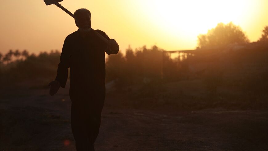 A farmer on the outskirts of the central Iraqi city of Hilla as temperatures soared past 45 degrees Celsius