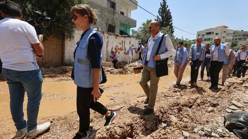 Members of an international delegation tour the Jenin camp for Palestinian refugees