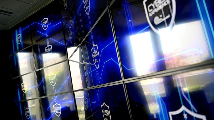 Logos are displayed on the screens at the cyberattack training facility "immersive cyberattack room", at the Galileo Global Education in Puteaux, west of Paris, on May 2, 2023. (Photo by Christophe ARCHAMBAULT / AFP) (Photo by CHRISTOPHE ARCHAMBAULT/AFP via Getty Images)