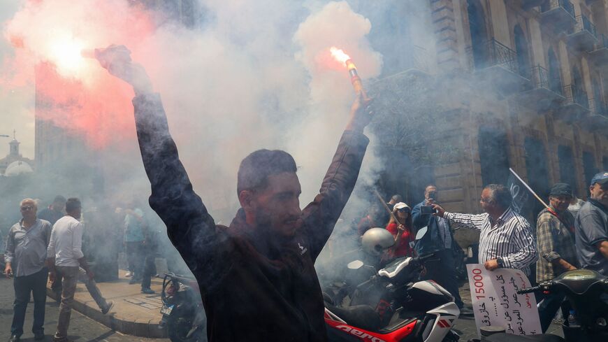 Lebanese protesters take part in a demonstration called for by the banks depositors committee against monetary policies, on May 9, 2023. Lebanon's economic meltdown, described by the World Bank as one of the worst in recent global history, has plunged most of the population into poverty according to the United Nations. (Photo by ANWAR AMRO / AFP) (Photo by ANWAR AMRO/AFP via Getty Images)