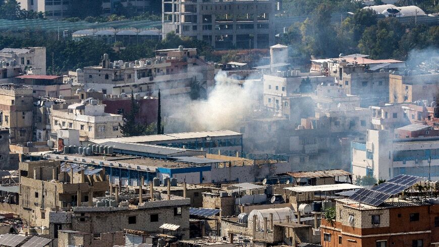 Smoke from the fighting billows over Ain al-Helweh