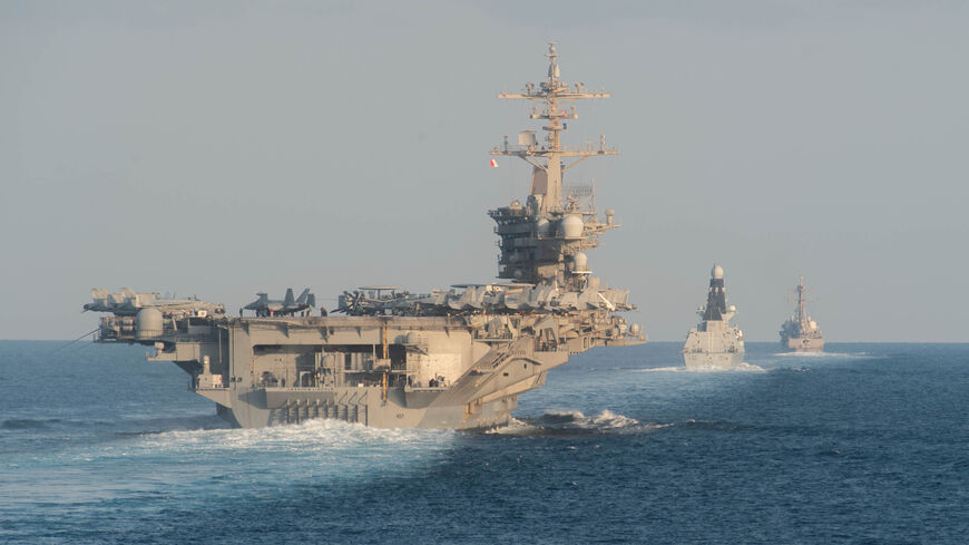 Aircraft carrier USS Abraham Lincoln (CVN 72), left.