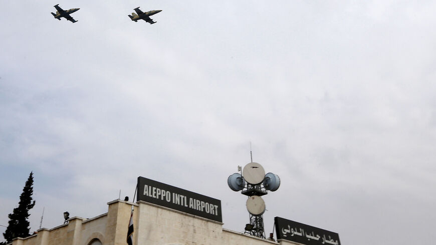 Syrian military airplanes fly by Aleppo's airport, February 19, 2020.