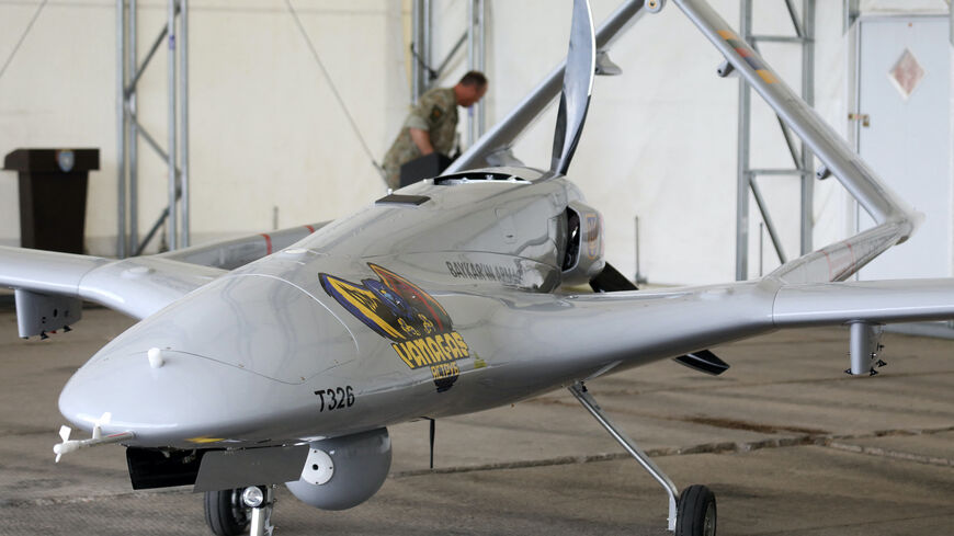 A Turkish Bayraktar TB2 combat drone is on view during a presentation at the Lithuanian Air Force Base in Siauliai, Lithuania, on July 6, 2022. 