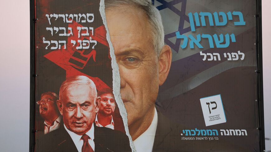 A picture shows a electoral banner for Israel's National Unity bloc, which includes the Blue and White (Kahol Lavan) led by Defence Minister Benny Gantz (R), and a portrait of Likud party leader Benjamin Netanyahu (L), in Tel Aviv on October 27, 2022, ahead of the November general elections. (Photo by AHMAD GHARABLI / AFP) (Photo by AHMAD GHARABLI/AFP via Getty Images)