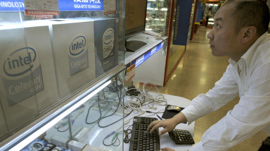 A man types on a keyboard next to the Intel products for sale in Beijing, on April 08, 2008.