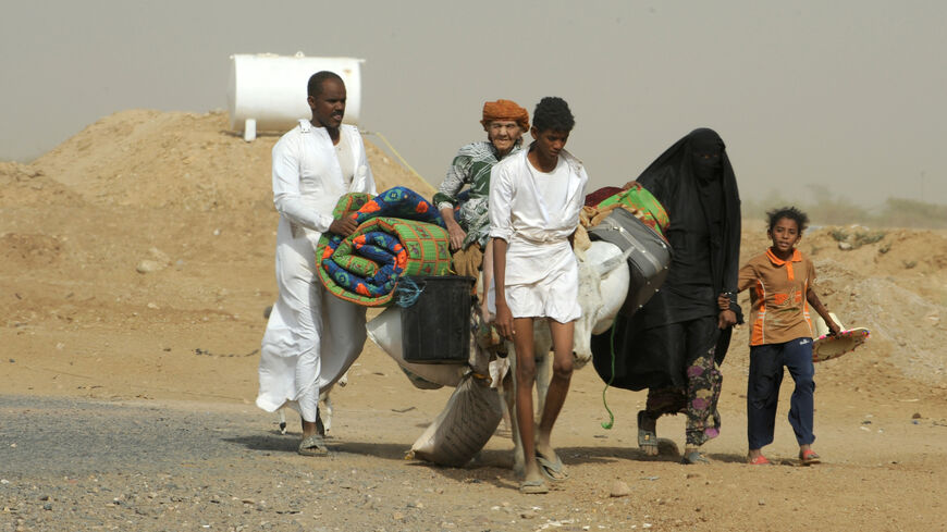 Yemeni refugees cross the border from Yemen into the southern Saudi province of Jizan on Nov. 8, 2009.