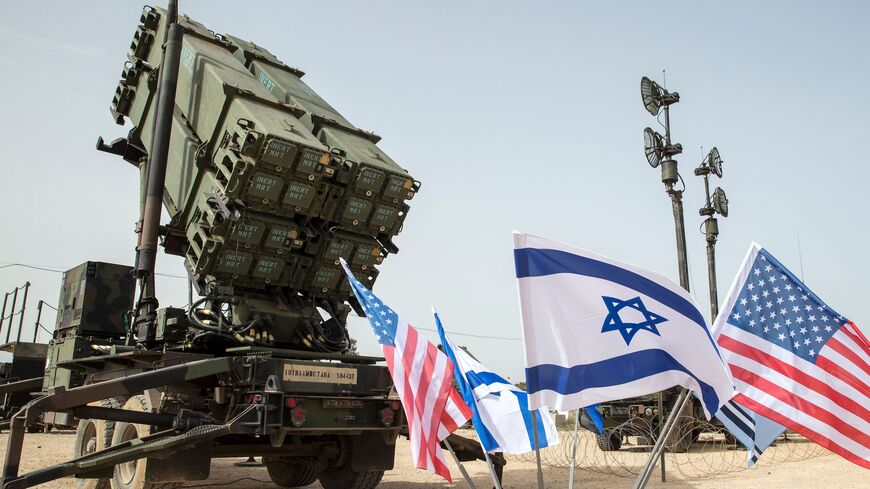 An Israeli Iron Dome anti-rocket system (L) and an US Patriot missile defense system (R) are exposed during a joint Israeli-US military exercise Juniper Cobra at the Hatzor Air Force Base, March 8, 2018.