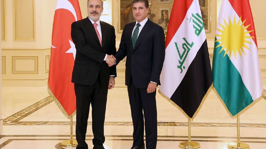 Turkey's Foreign Minister Hakan Fidan (L) held talks in the Iraqi northern city of Arbil with the president of the Kurdish autonomous region Nechirvan Barzani amid calls by Ankara for Baghdad to label the PKK a terrorist organisation