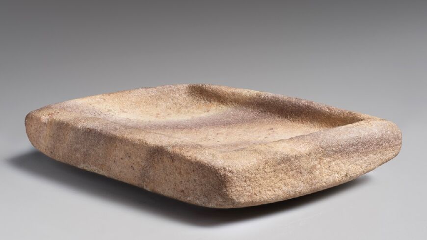 This handout photo by the Metropolitan Museum of Art shows a mortar made of veined marble, one of two Yemeni antiquities whose onwership has been transferred to Yemen, although the war-torn country agreed to leave them in New York for safekeeping