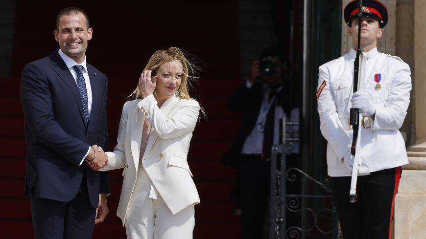 Malta’s Prime Minister Robert Abela (L) welcomes Italian Prime Minister Giorgia Meloni