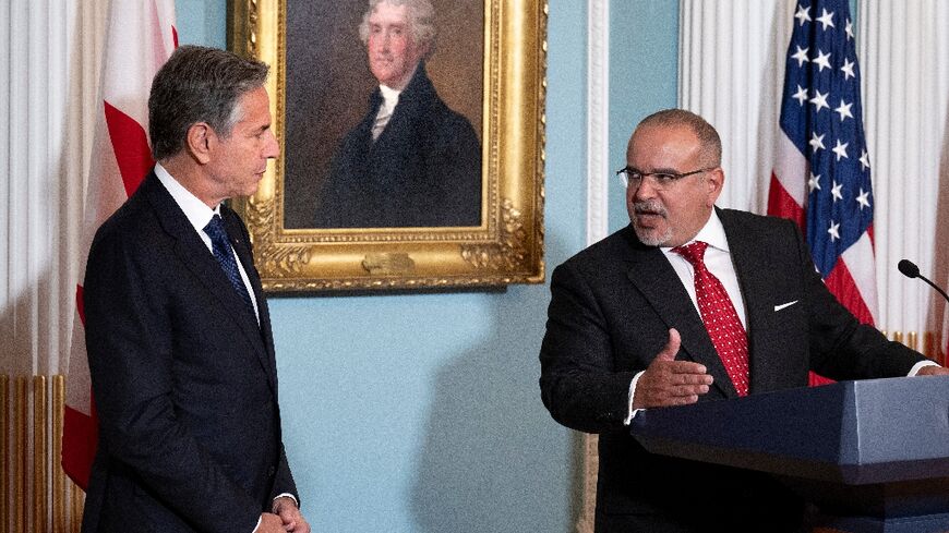 US Secretary of State Antony Blinken listens while Bahrain's Prime Minister and Crown Prince Salman bin Hamad Al Khalifa speaks during a signing ceremony at the State Department