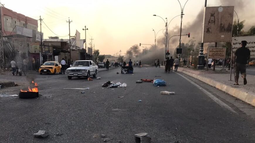 Iraqi protesters block a road following protests in the multi-ethnic Iraqi city of Kirkuk