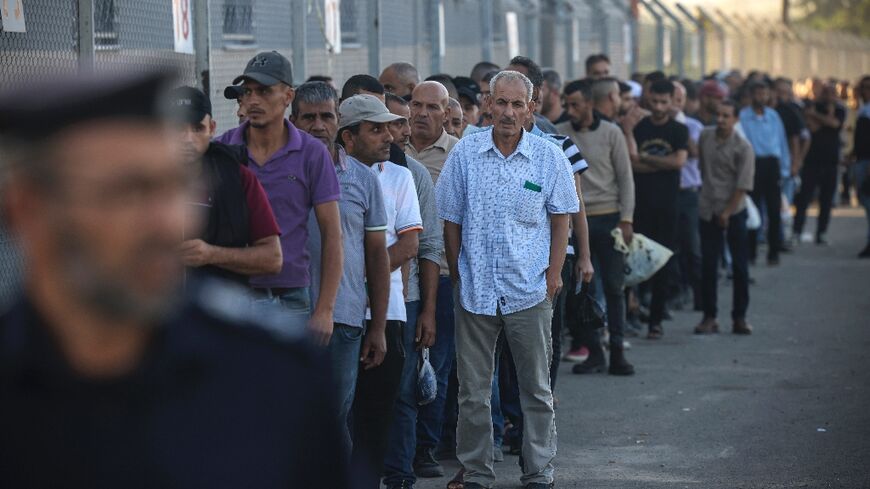 Palestinian workers gather at the Erez crossing between Israel and the Gaza Strip