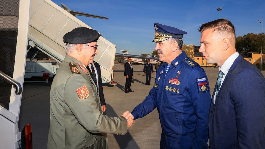 Military strongman Khalifa Haftar, whose forces dominate eastern Libya, is seen being welcomed by Deputy Defence Minister Yunus-Bek Yevkurov at a Moscow military airfield on Tuesday in this photograph released by his forces