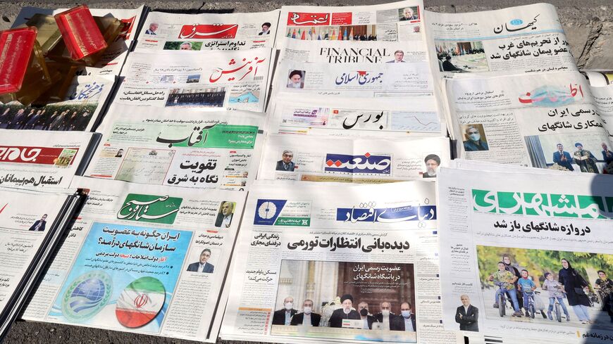 A picture shows daily newspapers on sale at a kiosk in the capital Tehran, on Sept. 18, 2021. 