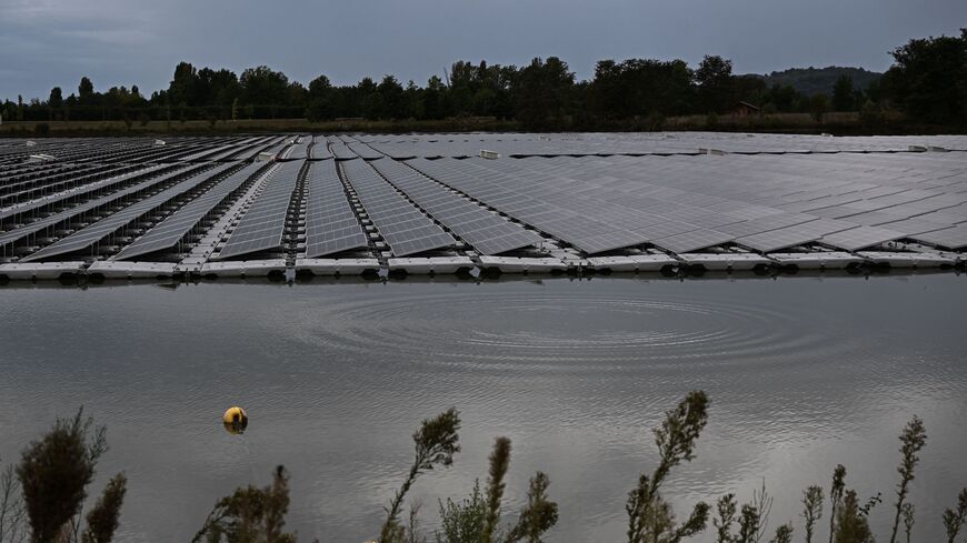 This photograph taken on Sept. 21, 2023, shows a view of a hybrid solar power plant, with solar panels on ground and floating, in southwestern France. 