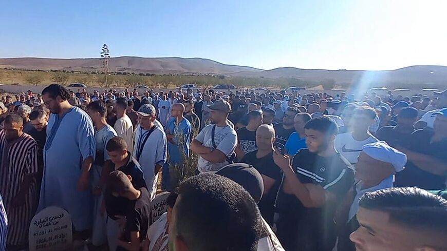 Mourners attend the funeral of Bilal Kissi, who was shot dead by the Algerian coastguard after straying across the maritime border, according to reports from Morocco