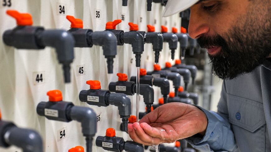 General manager Mohamed Ali al-Qahtani checks the quality of the ouput at the Ras al-Khair desalination plant