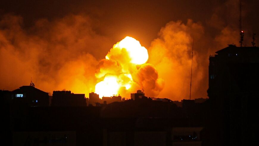 Fire and smoke rise above buildings in Gaza City during an Israeli air strike, a day after the surprise Hamas attack on Israel