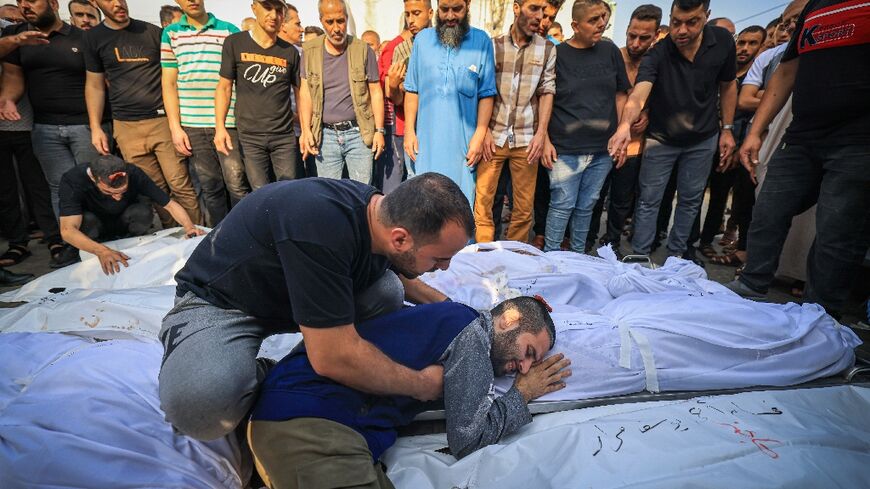 A man mourns the loss of a family member following a strike in the southern town of Khan Yunis