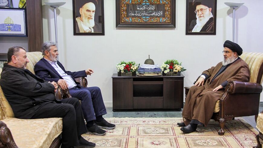 The leader of Lebanon's Iran-backed Hezbollah movement, Hassan Nasrallah (R), meets Hamas number two Saleh al-Aruri (L) and Islamic Jihad leader Ziad Nakhaleh (2nd-L) at an undisclosed location in Lebanon