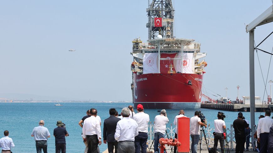 Media film and photograph the Abdulhamid Han drill ship, the fourth built by Turkey, in Mersin on August 9, 2022 before it leaves for gas exploration to an undisputed area in the Mediterranean Sea, in south of the city of Gazipasa. - Turkey on August 9, 2022 sent its newest drill ship on the first eastern Mediterranean energy exploration mission in nearly two years. The search for natural gas in energy-rich waters around the divided island of Cyprus has turned into an irritant in Turkey's ties with the Euro