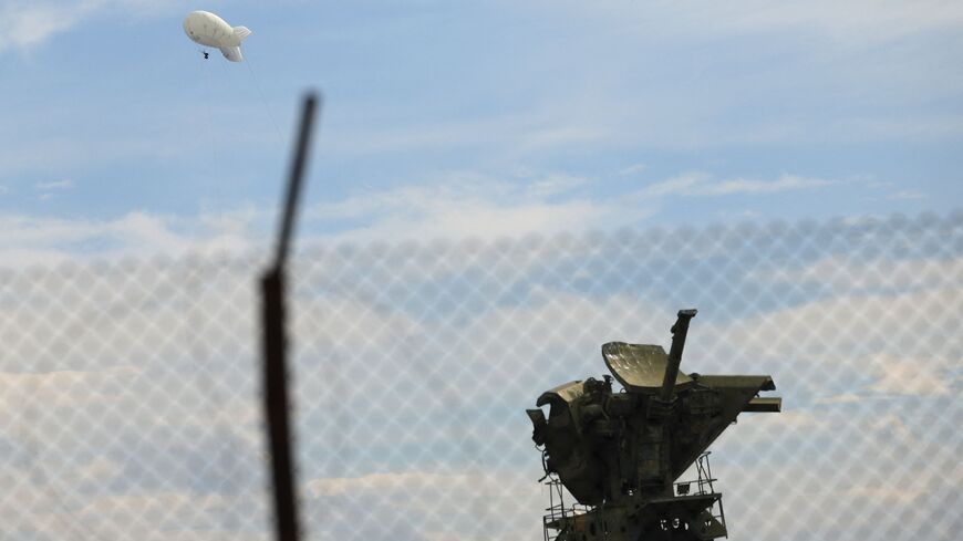 A civilian drone flies near the town of Khojaly in the Azerbaijani controlled region of Nagorno-Karabakh on October 2, 2023, during an Azeri government organized media trip. After three decades of Armenian control, the separatist authorities have agreed to disarm, dissolve their government and reintegrate with Azerbaijan in the wake of Baku's one-day military operation in late September. The separatist government said president Samvel Shahramanyan will stay in Karabakh's main city of Stepanakert with a grou