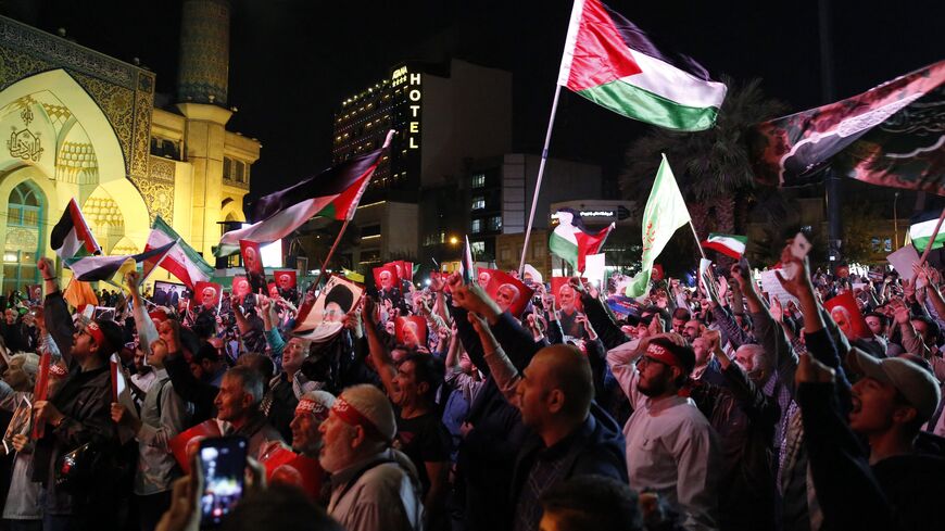 Iranians attend a gathering in Tehran on October 7, 2023, to express their solidarity with Palestine after Hamas militants launched a deadly air, land and sea assault into Israel from the Gaza Strip. A senior adviser to Iran's supreme leader Ayatollah Ali Khamenei voiced support for a deadly attack by Hamas on Israel, calling it a "proud operation". (Photo by AFP) (Photo by -/AFP via Getty Images)