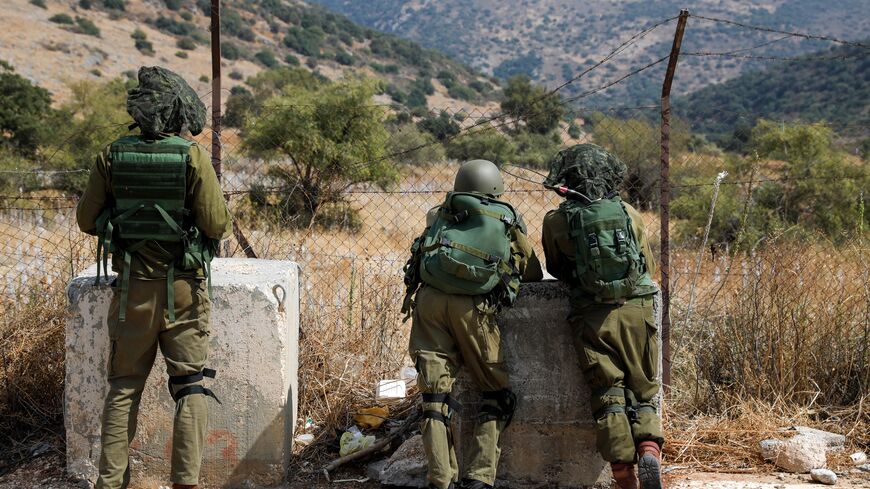 sraeli soldiers take positions near the Israeli military base of Har Dov on Mount Hermon, a strategic and fortified outpost at the crossroads between Israel, Lebanon, and Syria, on October 10, 2023. Israeli strikes on Lebanon killed three Hezbollah members on October 10 amid surging tensions after Palestinian militants tried to infiltrate Israel from Lebanon, in an escalation on Israel's northern border two days after Hamas militants launched an unprecedented attack on the country's southern flank from the