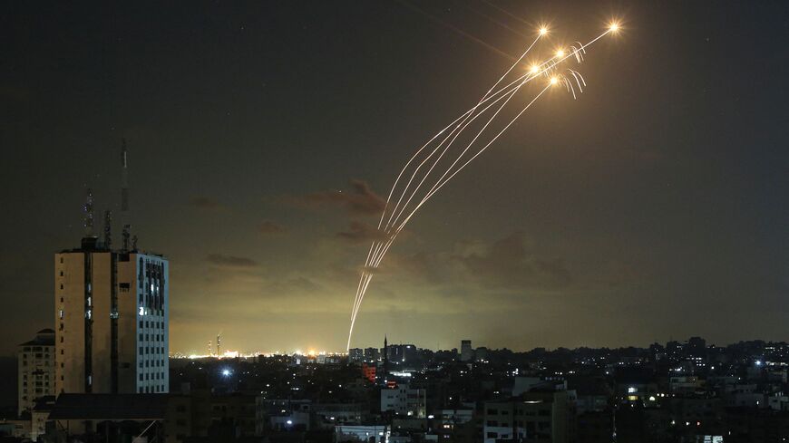 TOPSHOT - Israel's Iron Dome air defence system intercepts rockets launched from Gaza on October 11, 2023. Israel kept up its bombardment of Hamas targets in the Gaza Strip on October 11, as Prime Minister Benjamin Netanyahu and a political rival announced an emergency government for the duration of the conflict that has killed thousands. (Photo by Bashar TALEB / AFP) (Photo by BASHAR TALEB/AFP via Getty Images)