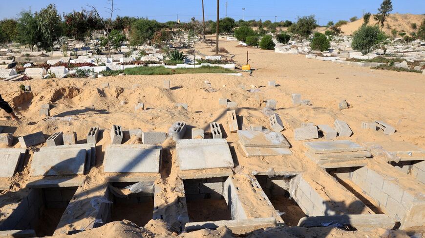 Graves are made ready to receive the new dead in the cemetery in Rafah, south of the Gaza Strip.