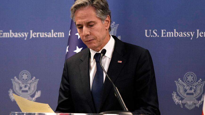 US Secretary of State Antony Blinken gathers his notes after speaking during a press conference in Tel Aviv, on October 17, 2023, after an overnight meeting with Israeli Prime Minister Benjamin Netanyahu. US President Joe Biden will pay a solidarity visit to Israel on October 18, 2023 following the Hamas attacks, Secretary of State Antony Blinken announced October 17, 2023. US President Joe Biden will travel from Israel to Amman on October 18, 2023 for talks with Palestinian leader Mahmud Abbas, Egyptian Pr