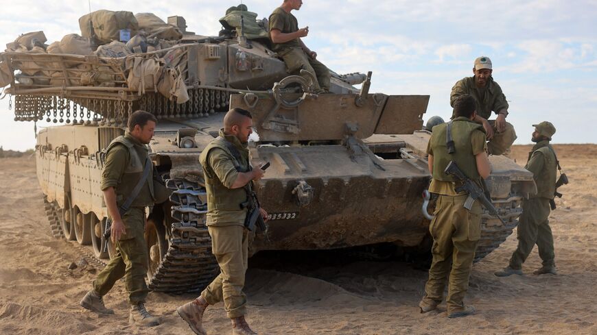 Israeli soldiers deploy near the border with Gaza on October 17, 2023. US President Joe Biden will visit Israel on October 18 in a show of "ironclad" support as Washington tries to prevent the escalating war against Hamas in Gaza from spilling into a wider Middle East conflict. (Photo by Menahem KAHANA / AFP) (Photo by MENAHEM KAHANA/AFP via Getty Images)