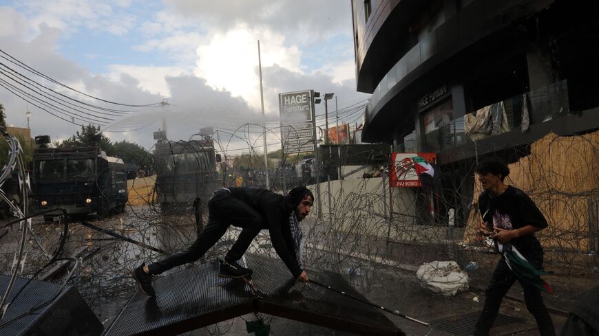 Lebanese security forces use water cannons as they clash with protesters outside the US Embassy in Awkar east of Beirut, during a demonstration in solidarity with the Palestinians of the Gaza Strip, on October 18, 2023. Thousands rallied across the Arab and Muslim world on October 18 to protest the deaths of hundreds of people in a strike on a Gaza hospital that they blame on Israel, despite its denials. (Photo by Ibrahim AMRO / AFP) (Photo by IBRAHIM AMRO/AFP via Getty Images)