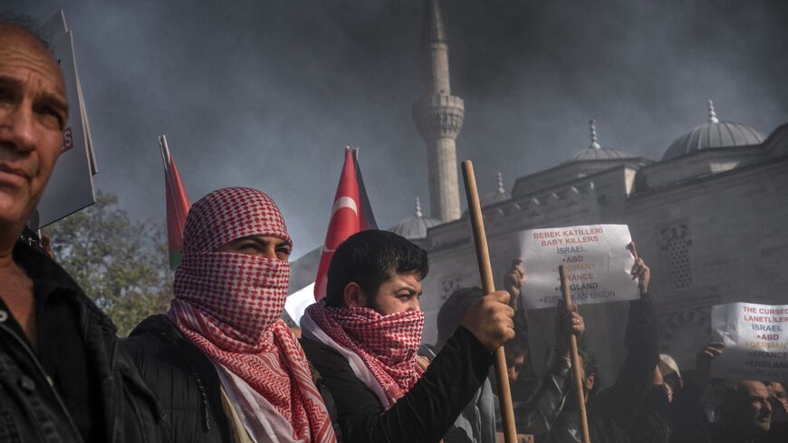 Protesters, some wearing a Keffiyeh, take part in a demonstration against Israel in Istanbul on October 20, 2023, after Turkey declared a three-day national mourning in solidarity with the Palestinian people. Israelis and Palestinians have traded blame for a deadly strike on a Gaza hospital this week, with the number of deaths given ranging from dozens to nearly 500. World leaders have condemned the strike and protests have erupted in Arab countries and the wider Muslim world amid stark disagreement over th