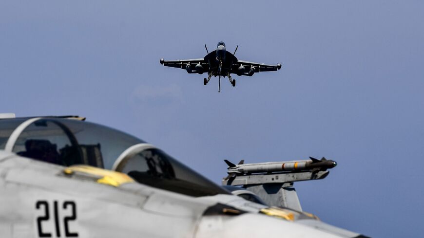 A F18 Hornet fighter jet prepares to land on the deck of a US navy aircraft carrier in the eastern Mediterranean Sea, May 8, 2018.