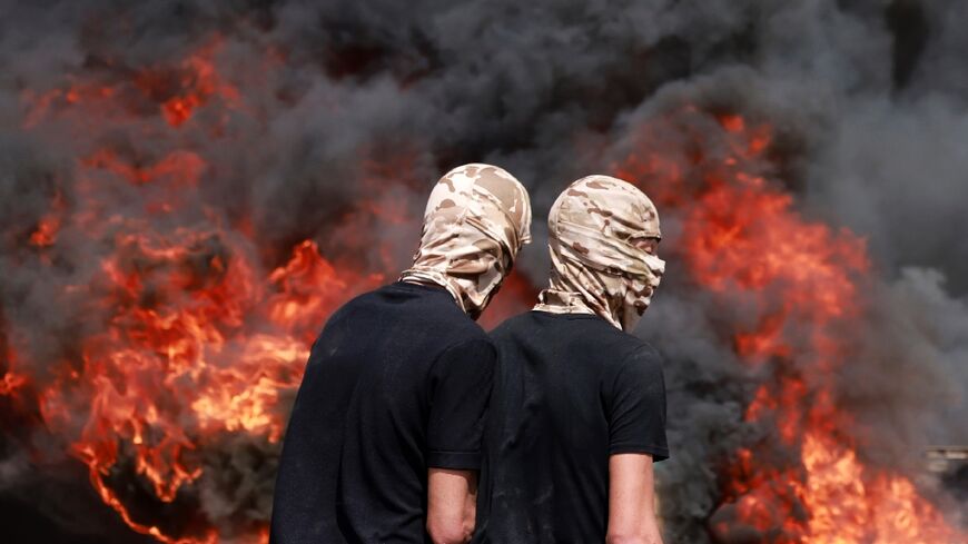 Palestinians burned tyres in clashes with Israeli security forces during Dmidi's funeral