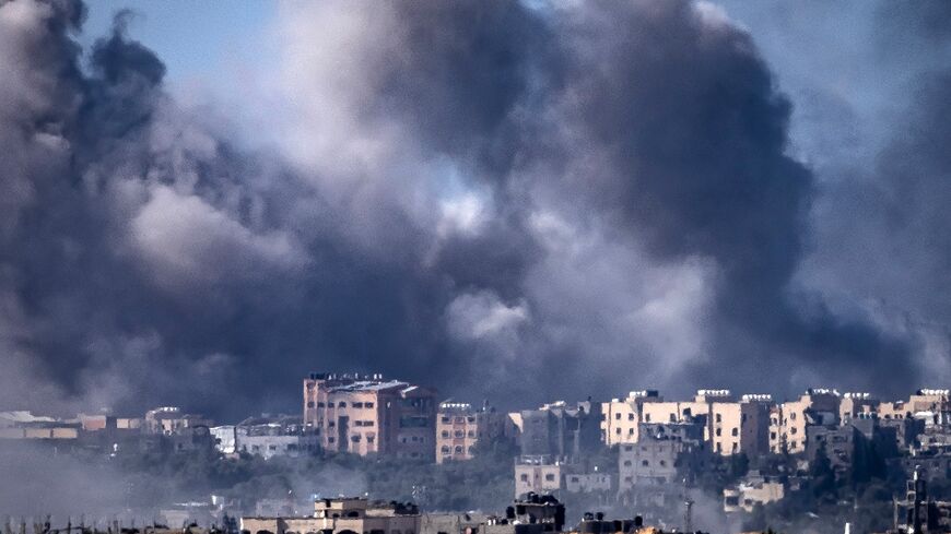 Somke rises over multiple targets in the Gaza Strip after an Israeli bombardment on Tuesday