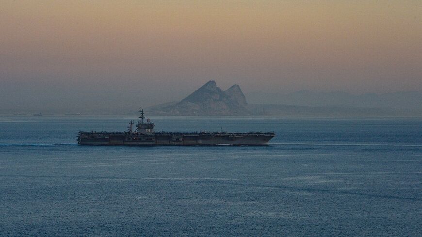 A photo obtained from the US Department of Defense shows the USS Dwight D. Eisenhower aircraft carrier transiting the Strait of Gibraltar on October 28, 2023