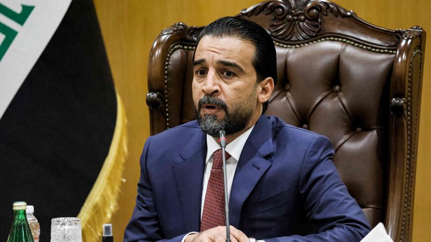 Iraqi Parliament Speaker Muhammad al-Halbousi addresses France's President Emmanuel Macron (unseen) during a meeting at the parliament in the capital Baghdad, on August 28, 2021. (Photo by Ludovic MARIN / AFP) (Photo by LUDOVIC MARIN/AFP via Getty Images)