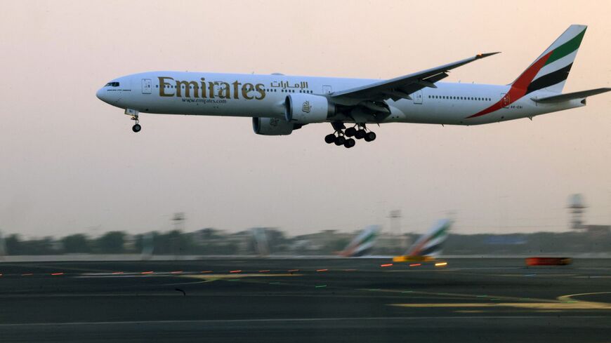 An Emirates Airlines plane lands at Dubai International Airport in Dubai on Oct. 17, 2023.