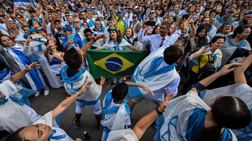 People attend a rally in support of the people of Israel in Sao Paulo, Brazil, on October 22, 2023. Thousands of people, both Israeli and Palestinians have died since October 7, 2023, after Palestinian Hamas militants based in the Gaza Strip, entered southern Israel in a surprise attack leading Israel to declare war on Hamas in Gaza the following day. (Photo by NELSON ALMEIDA / AFP) (Photo by NELSON ALMEIDA/AFP via Getty Images)