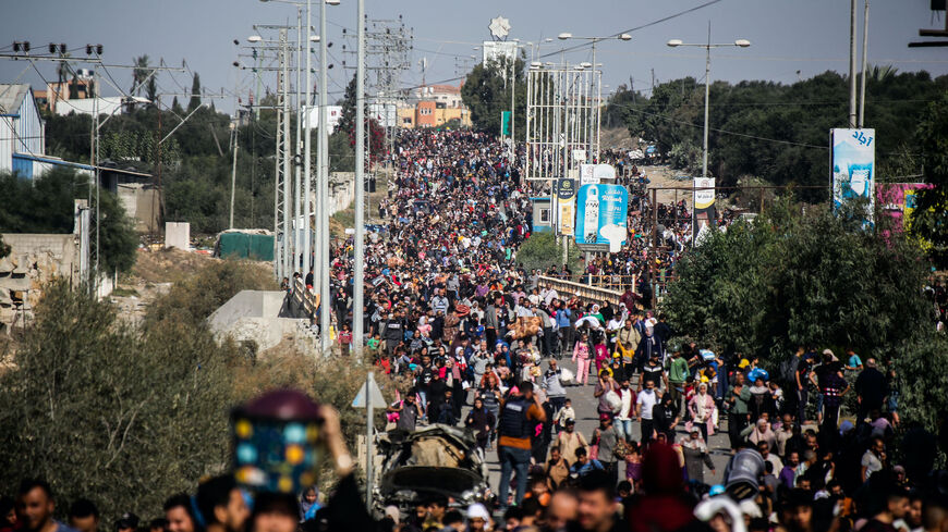 Palestinian citizens displaced from Gaza City to the southern Gaza Strip on Salah al-Din Street in the Al-Mughraqa area on Nov. 10, 2023 in Gaza.