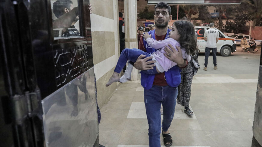 Palestinians injured in Israeli raids arrive at Nasser Medical Hospital on Nov. 14, 2023, in Khan Yunis, Gaza.