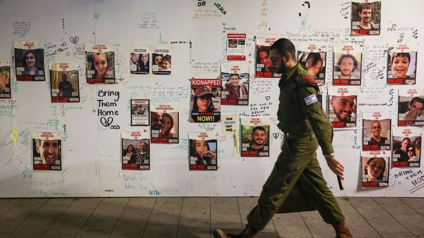 Forlorn Israeli soldier, hostages