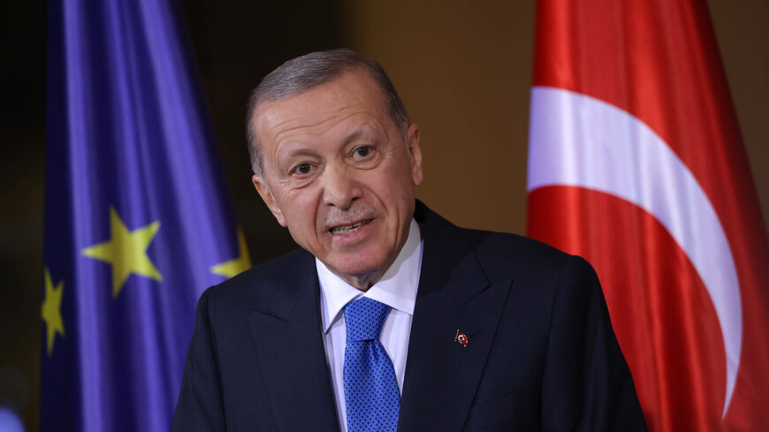 BERLIN, GERMANY - NOVEMBER 17: Turkish President Recep Tayyip Erdogan speaks to the media as he stands in front of a flag of the European Union before talks with German Chancellor Olaf Scholz at the Chancellery on November 17, 2023 in Berlin, Germany. Erdogan is on a one-day visit to meet with German leaders that is taking place following his recent vocal support of Hamas and his labelling of Israel as a "terror state", which is complicating his relation with Germany. (Photo by Sean Gallup/Getty Images)